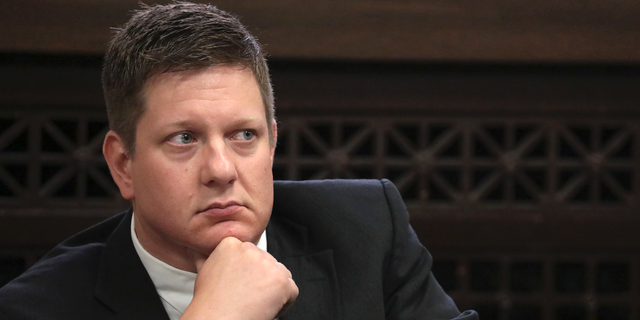 FILE - In this Thursday, Sept. 6, 2018, file photo, Chicago police Officer Jason Van Dyke, charged with murder in the shooting of black teenager Laquan McDonald in 2014, listens during a hearing at the Leighton Criminal Court Building in Chicago. Attorneys are expected to start questioning possible jurors in Van Dyke's trial on Monday, Sept. 10, 2018. (Antonio Perez/Chicago Tribune via AP, Pool, File)