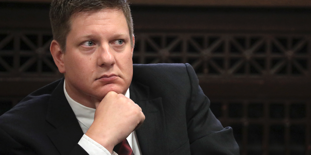 FILE - In this Thursday, Sept. 6, 2018, file photo, Chicago police Officer Jason Van Dyke, charged with murder in the shooting of black teenager Laquan McDonald in 2014, listens during a hearing at the Leighton Criminal Court Building in Chicago. Attorneys are expected to start questioning possible jurors in Van Dyke's trial on Monday, Sept. 10, 2018. (Antonio Perez/Chicago Tribune via AP, Pool, File)