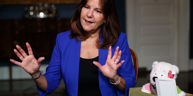 Karen Pence sits next to a Comfort Crew Kit to be given to a military child during an interview with The Associated Press at the Vice President's residence, the Naval Observatory, in Washington, Monday, Sept. 10, 2018. Being married to the vice president has its privileges. “Now people take my phone calls,” Karen Pence told The Associated Press in an interview. These days, Vice President Mike Pence’s wife is using her new cachet to call around on behalf of military spouses, looking to help them overcome the challenges that come with being wed to an active-duty service member.(AP Photo/Carolyn Kaster)