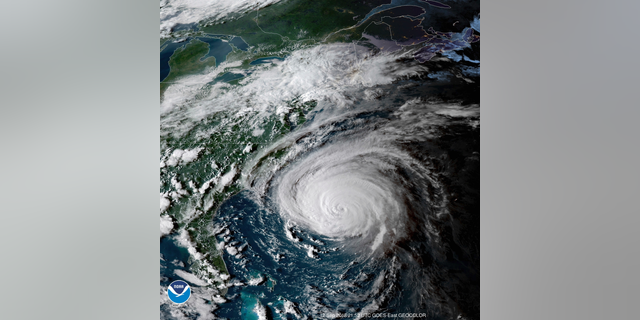 This enhanced satellite image made available by NOAA shows Hurricane Florence off the eastern coast of the United States on Wednesday, Sept. 12, 2018 at 5:52 p.m. EDT. (NOAA via AP)