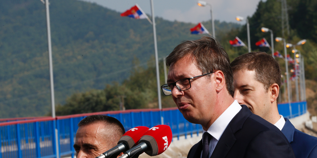 Serbian president Aleksandar Vucic, front, speaks during his visit to the Gazivode Dam near the village of Gazivode, Kosovo on Saturday, Sept. 8, 2018. Vucic is on a two day visit to Kosovo. (AP Photo/Visar Kryeziu)