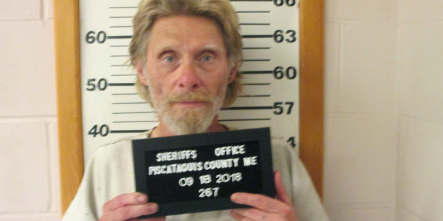 In this Tuesday, Sept. 18, 2018 photo provided by Piscataquis County Sheriff's Office, convicted murderer Arnold Nash stands for a booking photo, in Dover-Foxcroft, Maine. Nash was serving a 45-year sentence for killing his former neighbor in 1991. He previously escaped from Maine Correctional Center in Windham in 1973 and from the Maine State Prison in 1981. (Piscataquis County Sheriff's Office via AP)