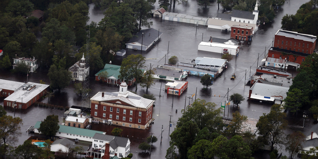 Floodwaters from Hurricane Florence inundate the town of Trenton, N.C., Sunday, Sept. 16, 2018. (AP Photo/Steve Helber)