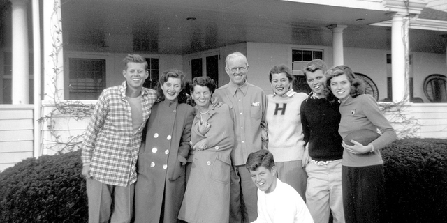 In this circa 1948 photo provided by the Kennedy Family Collection, courtesy of the John F. Kennedy Library Foundation, members of the Kennedy family pose for a photo in Hyannis Port, Mass. They are from left, John F. Kennedy, Jean Kennedy, Rose Kennedy, Joseph P. Kennedy Sr., Patricia Kennedy, Robert F. Kennedy, Eunice Kennedy, and in foreground, Edward M. Kennedy. The Boston-based museum completed an 18-month project in 2018 to catalog and digitize more than 1,700 black-and-white Kennedy family snapshots that are viewable online, giving a nation still obsessed with "Camelot" a candid new glimpse into their everyday lives. (Kennedy Family Collection/John F. Kennedy Library Foundation via AP)