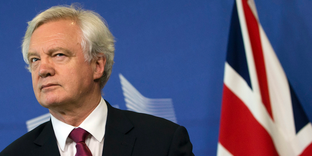 In this Monday June 19, 2017 file photo, British Secretary of State for Exiting the EU David Davis listens to opening remarks during his arrival at EU headquarters in Brussels. U.K. and European Union negotiators should be able to move from talks about Britain’s divorce terms to negotiating future relations before the end of the year, the top U.K. Brexit official said Tuesday, July 11, 2017.