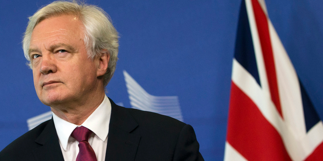 In this Monday June 19, 2017 file photo, British Secretary of State for Exiting the EU David Davis listens to opening remarks during his arrival at EU headquarters in Brussels. U.K. and European Union negotiators should be able to move from talks about Britain’s divorce terms to negotiating future relations before the end of the year, the top U.K. Brexit official said Tuesday, July 11, 2017.