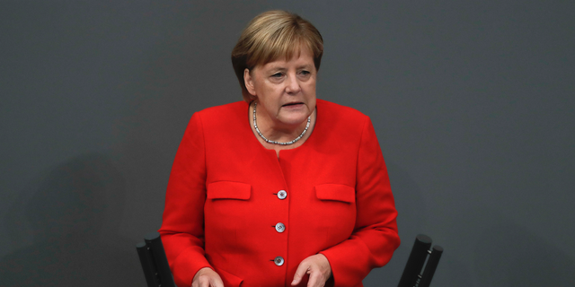 German Chancellor Angela Merkel delivers her speech during a plenary session of the German parliament Bundestag about the budget 2019, in Berlin, Wednesday, Sept. 12, 2018. (AP Photo/Markus Schreiber)