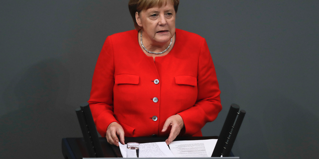German Chancellor Angela Merkel delivers her speech during a plenary session of the German parliament Bundestag about the budget 2019, in Berlin, Wednesday, Sept. 12, 2018. (AP Photo/Markus Schreiber)