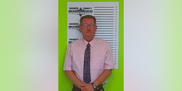This Wednesday, Sept. 5, 2018 booking photo released by the Kansas Bureau of Investigation shows Virgil "Dusty" Brewer. The Kansas undersheriff who fatally shot a man at close range with a beanbag has been charged with involuntary manslaughter. Kansas Bureau of Investigation agents arrested Brewer Wednesday at the Barber County Courthouse. (Kansas Bureau of Investigation via AP)