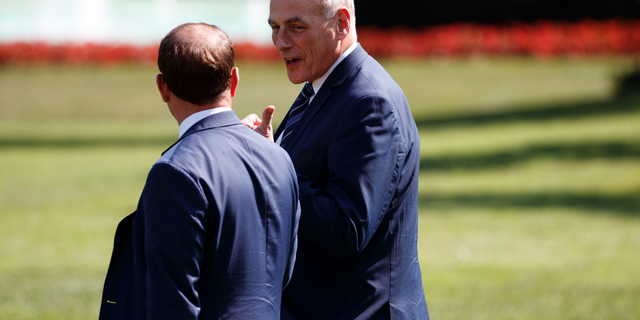 White House Chief of Staff John Kelly, right, follows President Donald Trump to board Marine One on the South Lawn of the White House, Thursday, Sept. 6, 2018, in Washington. (AP Photo/Evan Vucci)
