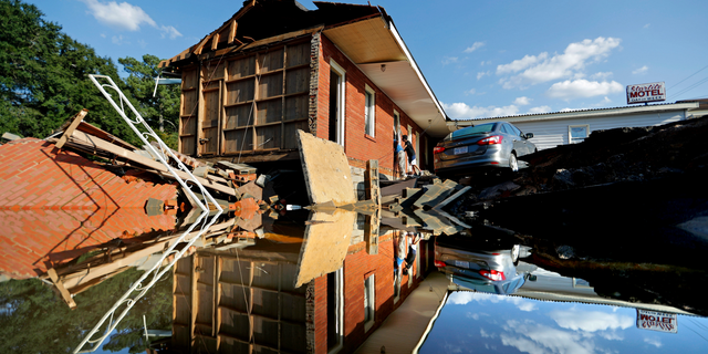 Part of the Starlite Motel is washed away in the aftermath of flooding from Hurricane Florence in Spring Lake, N.C., Wednesday, Sept. 19, 2018. (AP Photo/David Goldman)