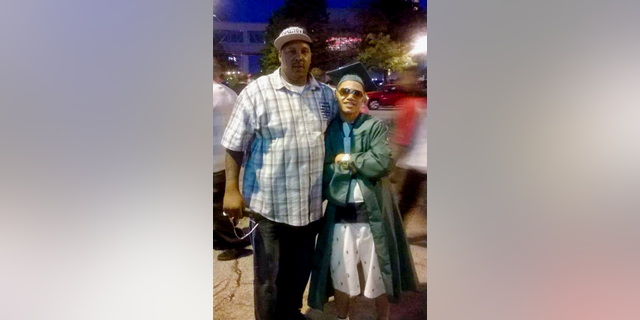 Terrill Thomas, seen at left with his son Terrill Barnes in this undated photo, died of dehydration in jail.