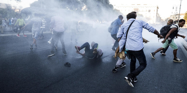 August 24, 2017: At least 13 were injured when police in Rome used water cannons to clear migrants out of a piazza.