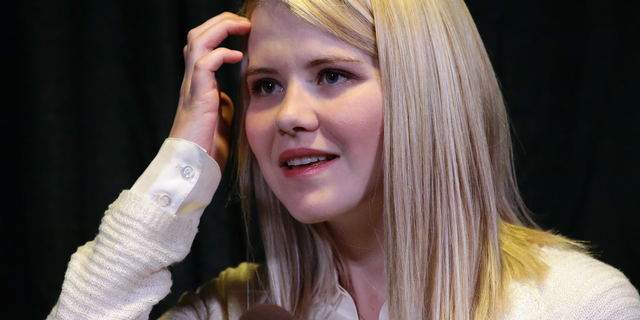 FILE - In this April 24, 2015, file photo, kidnapping survivor Elizabeth Smart looks on during a news conference in Sandy, Utah. Wanda Barzee, a woman convicted of helping a former street preacher kidnap Smart in 2002 will be freed from prison more than five years earlier than expected, a surprise decision that Smart called "incomprehensible" on Tuesday, Sept. 11, 2018. (AP Photo/Rick Bowmer, File)