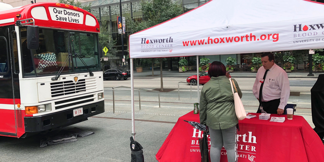 A blood donation station is set up at Fountain Square where a shooting took place on Sept. 6 that claimed the lives of three civilians, Monday, Sept. 10, 2018, in Cincinnati. The motives of the suspect Omar Enrique Santa Perez are still under investigation. (AP Photo/Dan Sewell)