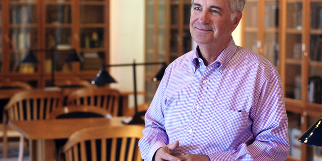 In this Tuesday, Sept. 11, 2018, photo, St. John's College President Mark Roosevelt talks about trends in student tuition and spending by colleges in Santa Fe, N.M. The college with campuses in Santa Fe and Annapolis, Md., is reducing its annual tuition price, adding grants for New Mexico residents and plans to rely more on philanthropy to defer academic costs to students. (AP Photo/Morgan Lee)