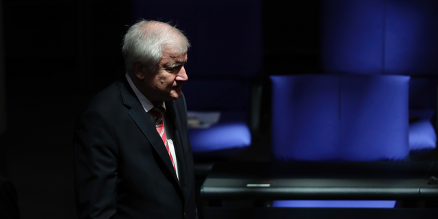 German Interior Minister Horst Seehofer arrives for a plenary session of the German parliament Bundestag about the budget 2019, in Berlin, Wednesday, Sept. 12, 2018. (AP Photo/Markus Schreiber)