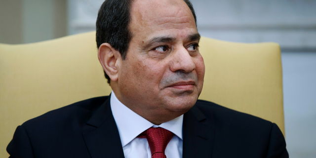 FILE - In this April 3, 2017 file photo, Egyptian President Abdel-Fattah El-Sissi listens during a meeting with President Donald Trump in the Oval Office of the White House in Washington. Echoing Trump’s rhetoric, authorities in Egypt are taking aim at an alleged barrage of “fake news” they say is meant to sow division and undermine the rule of general-turned-president el-Sissi. Government critics denounce the measures as the latest attempt to suppress dissent and silence what is left of independent journalism. (AP Photo/Evan Vucci, File)