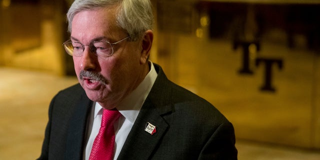 FILE - In this Dec. 6, 2016 file photo, Iowa Gov. Terry Branstad speaks to members of the media in the lobby of Trump Tower in New York. A Senate panel has approved Branstad as U.S. ambassador to China. (AP Photo/Andrew Harnik, File)
