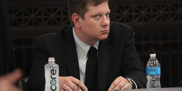 Chicago Police Officer Jason Van Dyke listens during his trial for the shooting death of Laquan McDonald at the Leighton Criminal Court Building, Monday, Sept. 17, 2018 in Chicago. McDonald died during a confrontation with Van Dyke on Oct. 20, 2014, in Chicago. (Antonio Perez/ Chicago Tribune via AP, Pool)