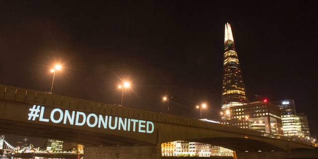 A tribute is projected onto the side of London Bridge, London, Sunday June 3, 2018, to mark one year since a deadly vehicle-and-knife attack on London Bridge.