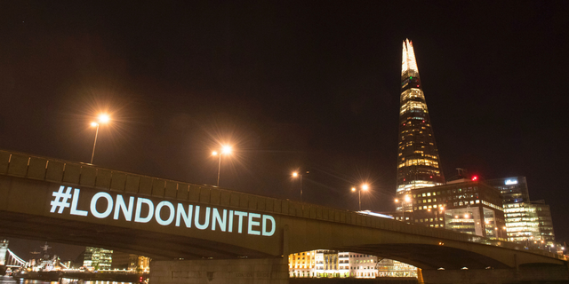 A tribute is projected onto the side of London Bridge, London, Sunday June 3, 2018, to mark one year since a deadly vehicle-and-knife attack on London Bridge.