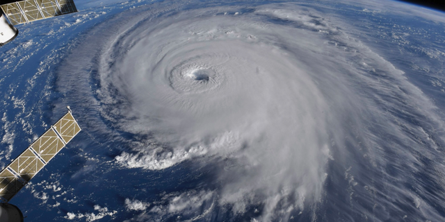 This image provided by NASA shows Hurricane Florence from the International Space Station on Wednesday, Sept. 12, 2018, as it threatens the U.S. East Coast. Hurricane Florence is coming closer and getting stronger on a path to squat over North and South Carolina for days, surging over the coast, dumping feet of water deep inland and causing floods from the sea to the Appalachian Mountains and back again. (NASA via AP)