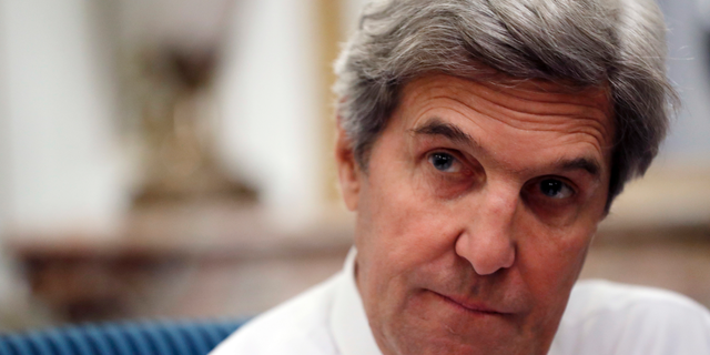 FILE - In this Jan. 15, 2017 file photo, U.S Secretary of State John Kerry speaks with the media after attending the Mideast peace conference in Paris. Secretary of State Mike Pompeo unloaded Friday, Sept. 14, 2018 on his Obama-era predecessor John Kerry for "actively undermining" U.S. policy on Iran by meeting several times recently with the Iranian foreign minister, who was his main interlocutor in the Iran nuclear deal negotiations. (AP Photo/Alex Brandon, Pool, File)