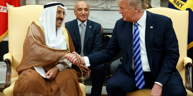 President Donald Trump shakes hands as he meets with Emir of Kuwait Sheikh Sabah Al Ahmad Al Sabah in the Oval Office of the White House, Wednesday, Sept. 5, 2018, in Washington. (AP Photo/Evan Vucci)