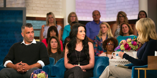 In this Aug. 27, 2018 photo released by NBC, Mark D'Amico, left, and Kate McClure speak with host Megyn Kelly on "Megyn Kelly Today," in New York.