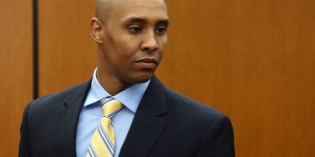 FILE - In this May 8, 2018, file photo, former Minneapolis police officer Mohamed Noor arrives at the Hennepin County Government Center for a hearing in Minneapolis. Noor is charged in the July 2017 shooting death of Justine Ruszczyk Damond, of Australia, who had called 911 to report a possible assault. Court records show psychiatrists and training officers voiced concerns about Noor's fitness for duty long before he fatally shot Damond. (AP Photo/Jim Mone, File)