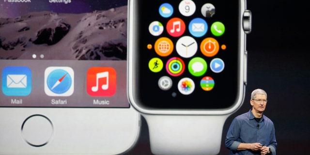 Apple CEO Tim Cook speaks during an Apple event announcing the iPhone 6 and the Apple Watch at the Flint Center in Cupertino, California, September 9, 2014. REUTERS/Stephen Lam (United States - Tags: SCIENCE TECHNOLOGY BUSINESS TPX IMAGES OF THE DAY) - RTR45KY7