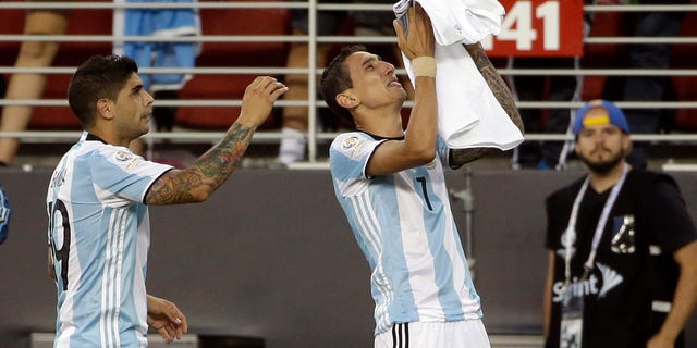 Argentinaâs Angel Di Maria, right, holds a t-shirt that reads "grandmother I will miss you a lot" after he scored against Chile during a Copa America Centenario Group A soccer match at the Levi's Stadium in Santa Clara, Calif., Monday, June 6, 2016. At left is Argentinaâs Ever Banega. (AP Photo/ Marcio Jose Sanchez)
