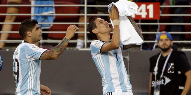 Argentinaâs Angel Di Maria, right, holds a t-shirt that reads "grandmother I will miss you a lot" after he scored against Chile during a Copa America Centenario Group A soccer match at the Levi's Stadium in Santa Clara, Calif., Monday, June 6, 2016. At left is Argentinaâs Ever Banega. (AP Photo/ Marcio Jose Sanchez)