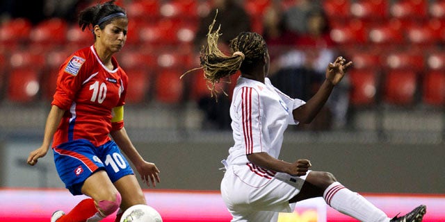 Costa Rica's Shirley Cruz (10) blocks a kick from Cuba's Jessica Alvarez Pupo, right in CONCACAF Women's Olympic qualifying soccer in Vancouver, British Columbia, Thursday, Jan. 19, 2012. Costa Rica won 2-0. (AP Photo/The Canadian Press, Jonathan Hayward)