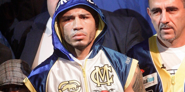 Miguel Cotto, of Puerto Rico, arrives for an WBA World Junior Middleweight Championship boxing match against Antonio Margarito, of Mexico, Saturday, Dec. 3, 2011 in New York. Cotto defeated Margarito with a TKO decision amid confusion in the corner before they came out for the 10th round. (AP Photo/Frank Franklin II)
