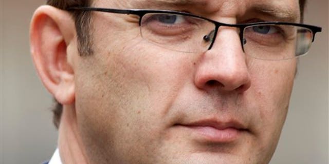 May 10, 2012: In this file photo, Andy Coulson, the former editor of the News of the World newspaper and former director of communications for Britain's Prime Minister David Cameron arrives to appear at the Leveson Inquiry at the High Court in London.