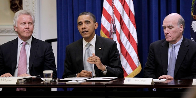 In this file photo, President Obama is shown with GE Chairman Jeffrey Immelt, left, and White House Chief of Staff, Bill Daley, during his meeting with his Council on Jobs and Competitiveness in Washington.