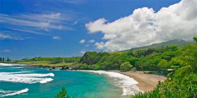 This undated file photo provided by Ron Dahlquist for the Maui Visitors Bureau shows Hamoa Beach in Maui, Hawaii.
