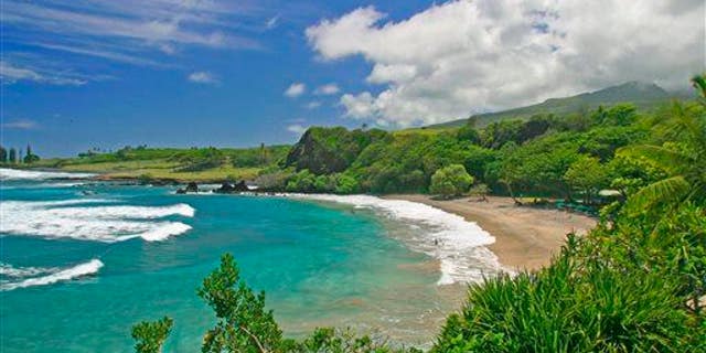 This undated file photo provided by Ron Dahlquist for the Maui Visitors Bureau shows Hamoa Beach in Maui, Hawaii.