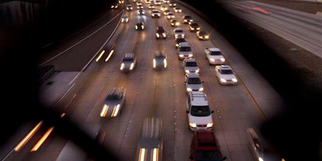 In this 2011 file photo, cars fill the highway in San Diego.