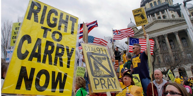 FILE: March 7, 2012: Gun owners and supporters participate in an Illinois Gun Owners Lobby Day rally at the Illinois State Capitol in Springfield.