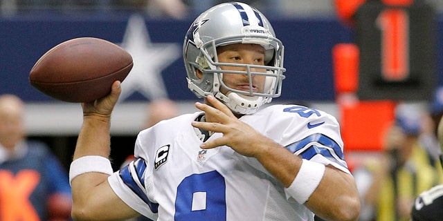 FILE - In this Dec. 23, 2012 file photo, Dallas Cowboys quarterback Tony Romo (9) passes the ball against the New Orleans Saints during the first half of an NFL football game in Arlington, Texas. Romo will miss at least three weeks of offseason workouts after a procedure to remove a cyst from his back. The team's website reported Tuesday, May 21, 2013 that Romo underwent the procedure last month and could return for the mandatory minicamp that starts June 11. (AP Photo/Brandon Wade, File)