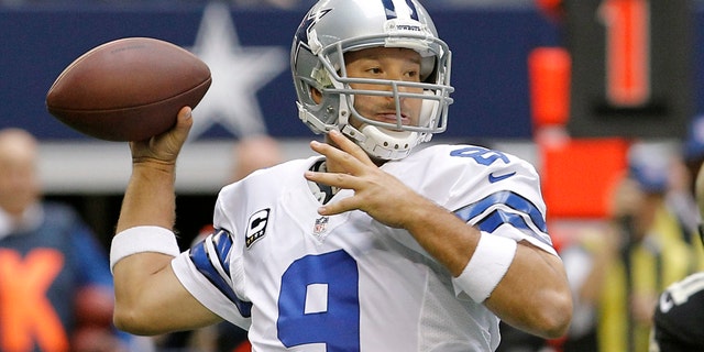 FILE - In this Dec. 23, 2012 file photo, Dallas Cowboys quarterback Tony Romo (9) passes the ball against the New Orleans Saints during the first half of an NFL football game in Arlington, Texas. Romo will miss at least three weeks of offseason workouts after a procedure to remove a cyst from his back. The team's website reported Tuesday, May 21, 2013 that Romo underwent the procedure last month and could return for the mandatory minicamp that starts June 11. (AP Photo/Brandon Wade, File)