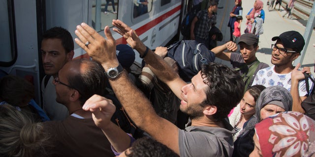 Sept. 18, 2015 -Migrants board a train in Beli Manastir, near the Hungarian border, northeast Croatia.