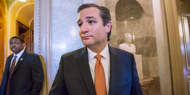 Sen. Ted Cruz, R-Texas leaves the floor of the Senate on Capitol Hill in Washington, Monday, Sept. 23, 2013, after a testy exchange with Senate Majority Leader Harry Reid, D-Nev., at the start of legislative business. Cruz and fellow tea party conservatives on Sunday said President Barack Obama and his Democratic allies would be to blame if they don't accede to GOP demands to strike down the national health care law. Conservatives in the House on Friday approved legislation to keep the government running but at the cost of wiping out the Affordable Care Act, popularly known at "Obamacare."  (AP Photo/J. Scott Applewhite)