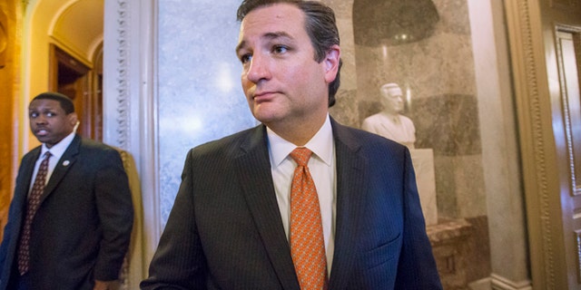 Sen. Ted Cruz, R-Texas leaves the floor of the Senate on Capitol Hill in Washington, Monday, Sept. 23, 2013, after a testy exchange with Senate Majority Leader Harry Reid, D-Nev., at the start of legislative business. Cruz and fellow tea party conservatives on Sunday said President Barack Obama and his Democratic allies would be to blame if they don't accede to GOP demands to strike down the national health care law. Conservatives in the House on Friday approved legislation to keep the government running but at the cost of wiping out the Affordable Care Act, popularly known at "Obamacare." (AP Photo/J. Scott Applewhite)