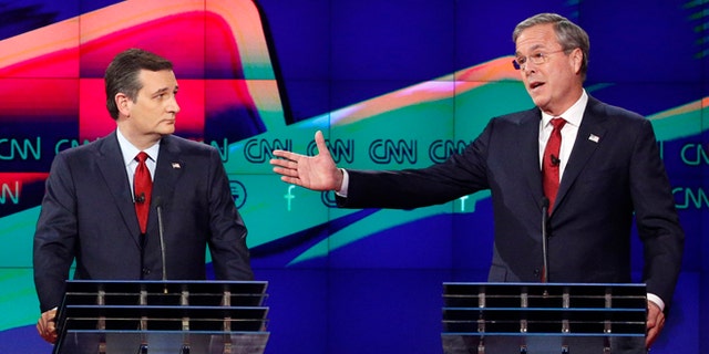 FILE - In this Dec. 15, 2015 file photo, former Florida Gov. Jeb Bush, right, makes a point as Sen. Ted Cruz, R-Texas listens on during the Republican presidential debate in Las Vegas. Ted Cruz once proudly wore a belt buckle reading President of the United States borrowed from George H.W. Bush. He campaigned and worked for, and helped write a book lavishing praise on, that former presidents son, Dubya. And the endorsement of George P. Bush, the familys latest rising political star, lent credibility to Cruzs then little-known 2012 Senate campaign. (AP Photo/John Locher, File)