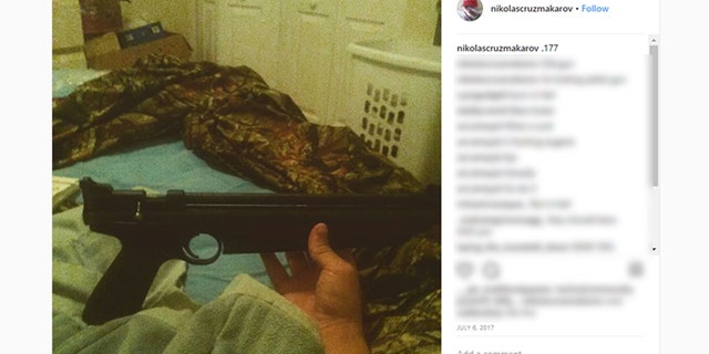 A picture on Nikolas Cruz's Instagram page shows him holding a rifle.