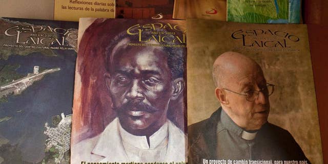 This June 25, 2014, photo, shows issues of the Roman Catholic magazine Espacio Laical exhibited for sale in a small shop in Old Havana, Cuba. The editors of the magazine, Roberto Veiga and Lenier Gonzalez resigned in early May, later confirming they quit because the magazine's content was controversial in the ecclesiastical community. The magazine’s director, Gustavo Andujar, said the editors left voluntarily. (AP Photo/Franklin Reyes)